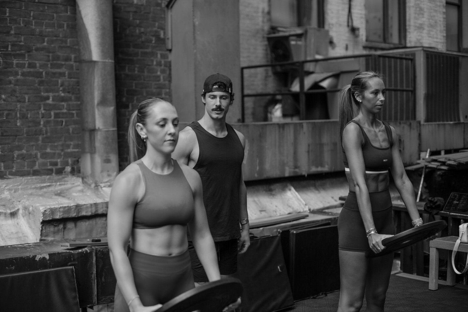 Clients walking with weight plates